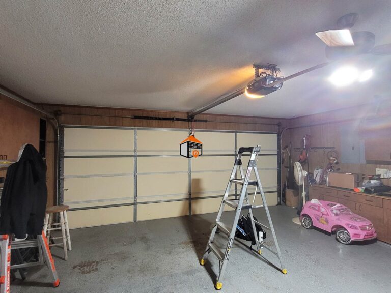 My-one-piece-garage-door-has-a-roller-on-the-top-left-and-right-hand-corners-of-the-door-with-track-to-roll-back